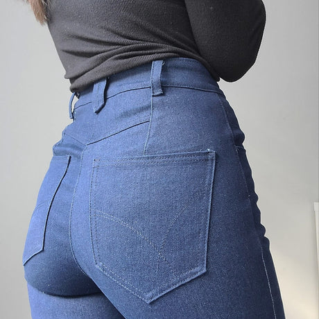 Denim jeans on woman.  Back pocket detail.