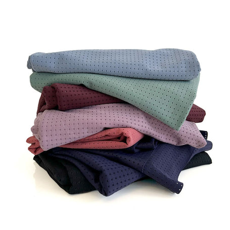 stack of multi colour athletic mesh fabric