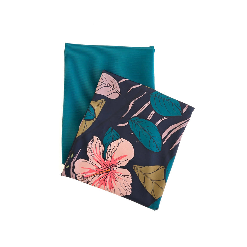 Two fabric swatches, one teal and one with floral pattern, on a white background.