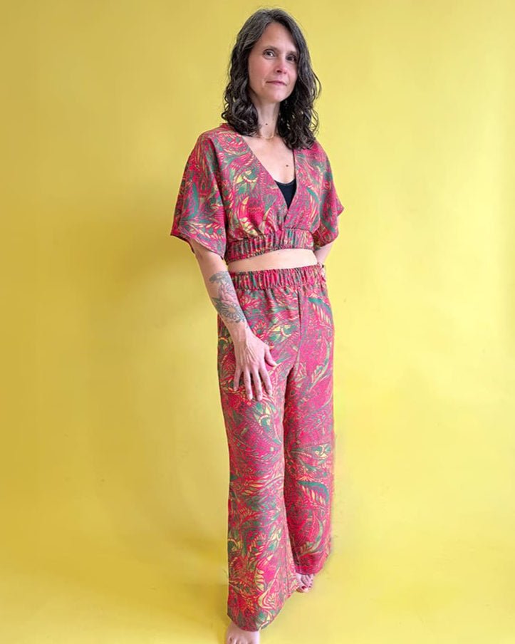 Woman wearing a colorful outfit against a yellow background